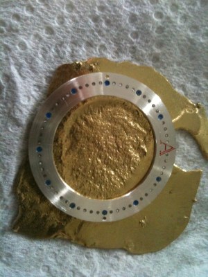 Register ring on rough piece of gold Register ring on rough piece of gold